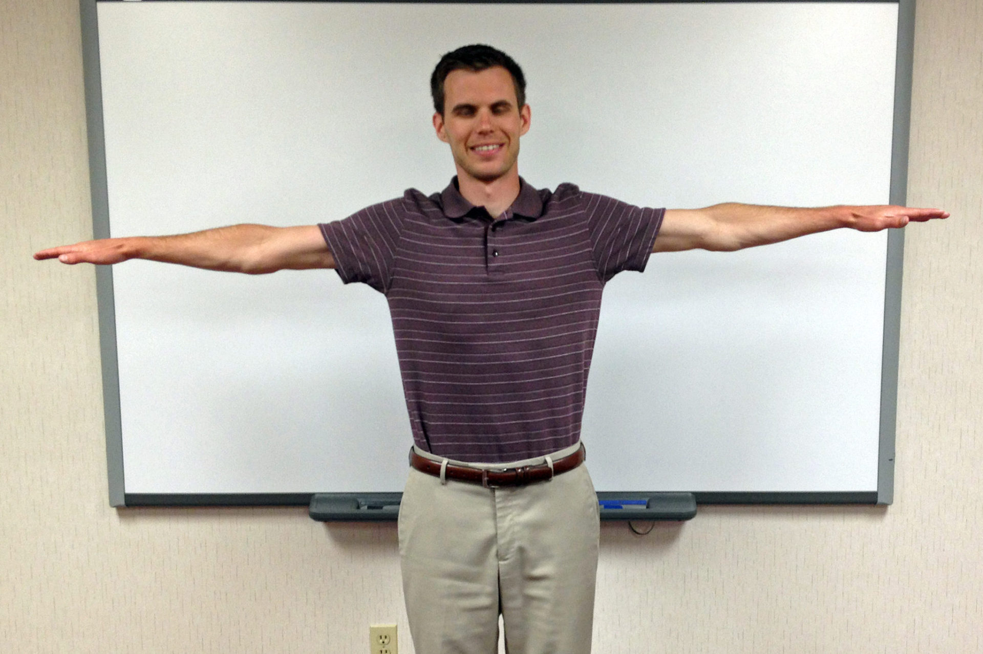 Emergency stop hand signal both arms parallel to ground