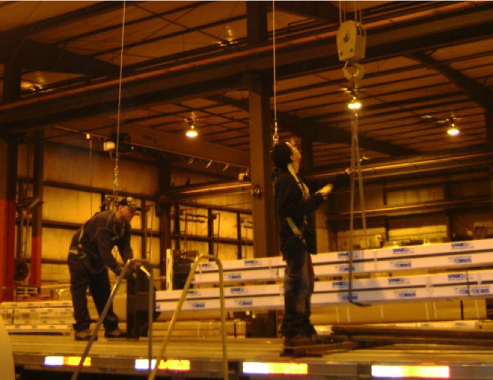 Lead worker controlling crane with pendant station